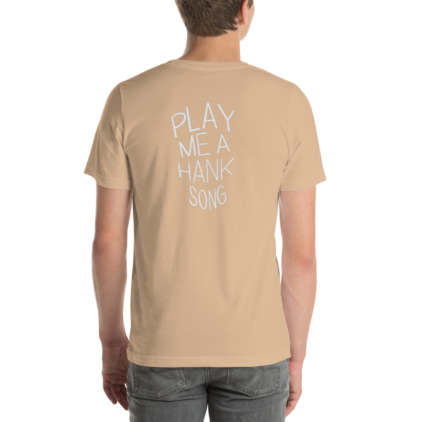 Model wearing a tan 'Play me a Hank song' t-shirt.